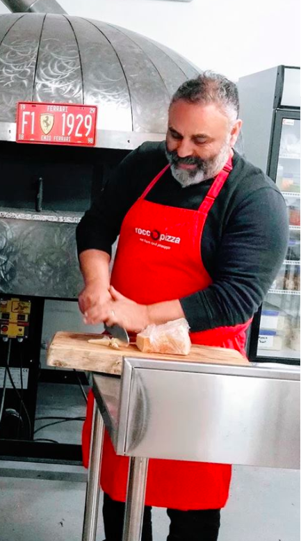 rocco making pizza