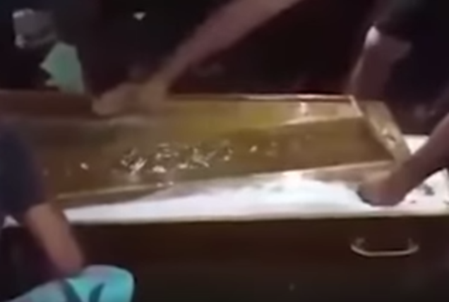 family opening casket