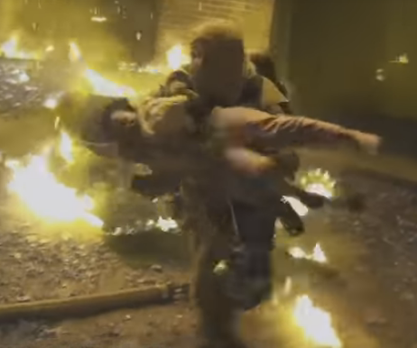 firefighter runs with child